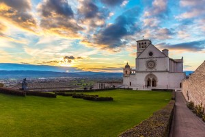 The awesome medieval stone town in Umbria region, with catholic sanctuary, at sunset