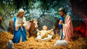 Christmas nativity scene with baby Jesus, Mary & Joseph in barn