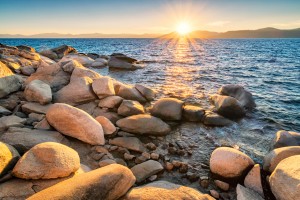 Stock photograph of the stony shores of Lake Tahoe, as seen from the Nevada side, USA at sunset.