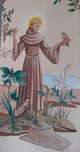 Uma obra pintada de São Francisco de Assis em contato com a natureza: Espiritualidade e ecologia.